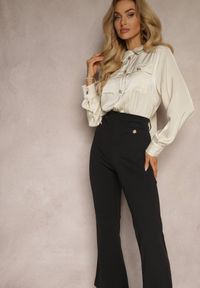 Renee - Czarno-Beżowy Kombinezon z Koszulową Górą Zdobiony Wiązaniem i Eleganckimi Guzikami Eliti. Okazja: na spotkanie biznesowe. Kolor: czarny. Długość rękawa: długi rękaw. Długość: długie. Wzór: aplikacja. Styl: elegancki