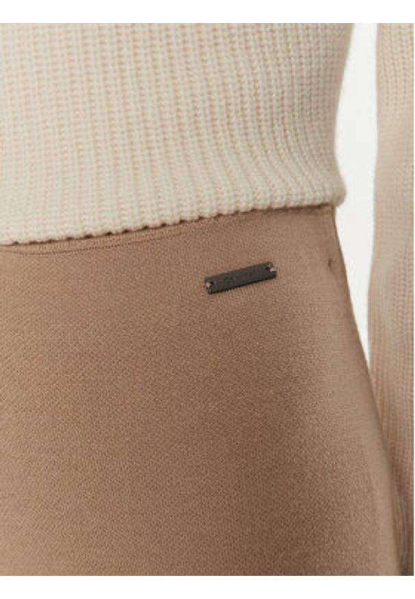 Calvin Klein Spodnie dresowe K20K207680 Beżowy Relaxed Fit. Kolor: beżowy. Materiał: wełna