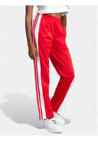 Adidas - adidas Spodnie dresowe Adibreak IP0620 Czerwony Regular Fit. Kolor: czerwony. Materiał: syntetyk