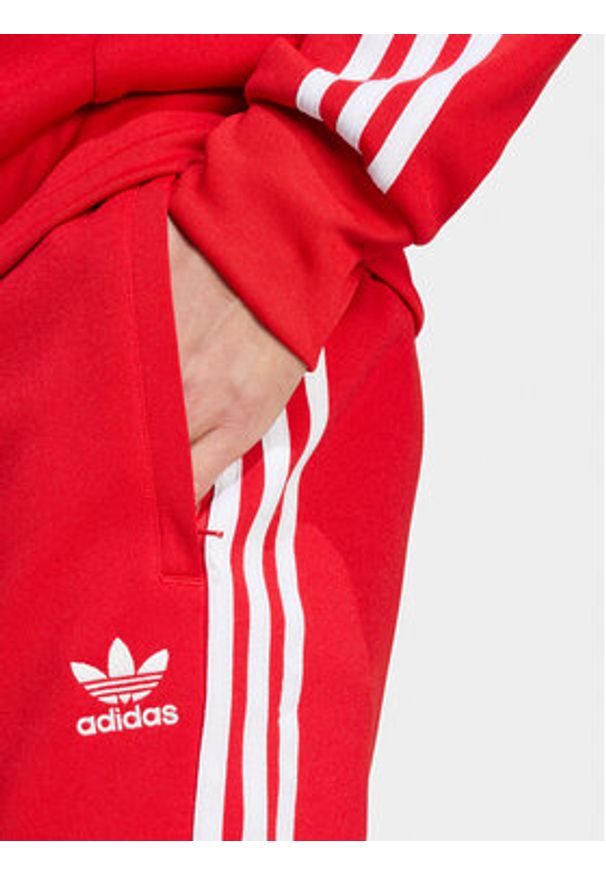Adidas - adidas Spodnie dresowe adicolor Classics SST IM4543 Czerwony Slim Fit. Kolor: czerwony. Materiał: bawełna, syntetyk