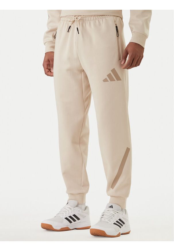 Adidas - adidas Spodnie dresowe Z.N.E. KE4684 Beżowy Regular Fit. Kolor: beżowy. Materiał: syntetyk