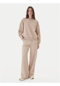 Guess Spodnie dresowe V5BB12 KCX22 Beżowy Regular Fit. Kolor: beżowy. Materiał: syntetyk #5