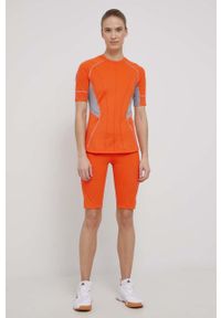 Adidas by Stella McCartney - adidas by Stella McCartney t-shirt treningowy kolor pomarańczowy. Kolor: pomarańczowy. Materiał: materiał, poliester, skóra, dzianina. Wzór: ze splotem, ażurowy