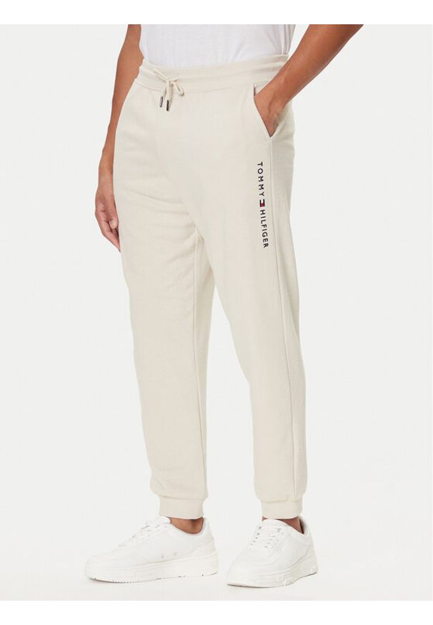 TOMMY HILFIGER - Tommy Hilfiger Spodnie dresowe UM0UM03664 Écru Regular Fit. Materiał: bawełna