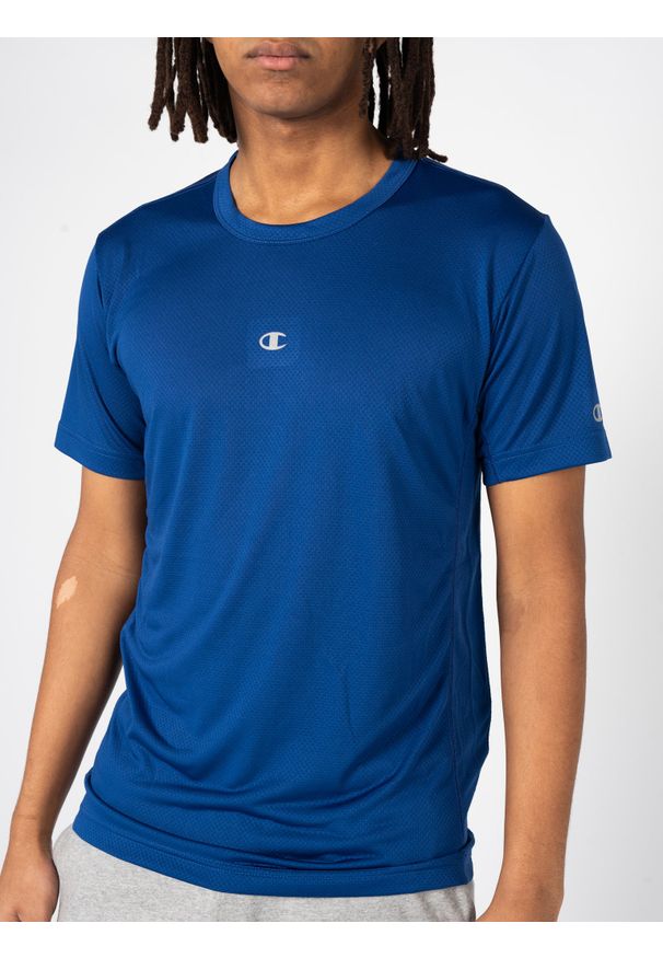 Champion T-Shirt | 218038 | Mężczyzna | Niebieski. Okazja: na co dzień. Kolor: niebieski. Materiał: poliester. Długość rękawa: krótki rękaw. Wzór: nadruk. Styl: klasyczny, casual
