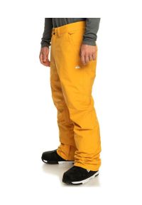 Spodnie snowboardowe męskie Quiksilver Estate. Kolor: żółty. Sezon: zima. Sport: snowboard