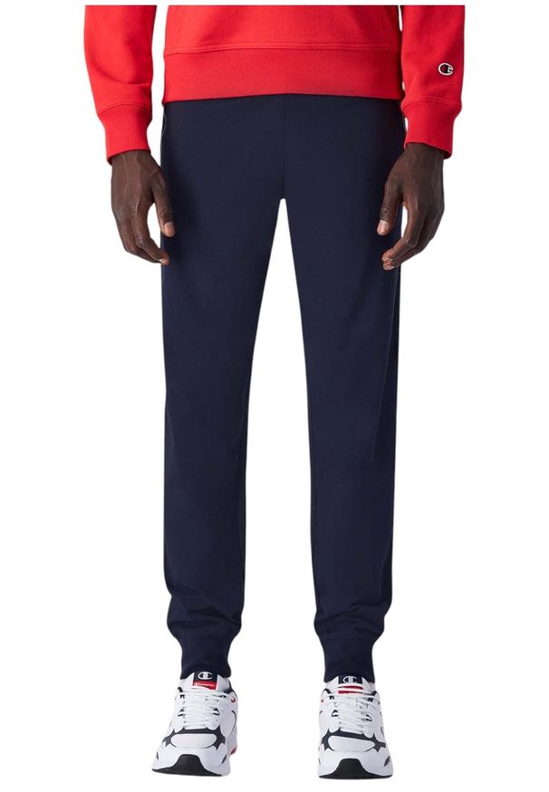 Spodnie sportowe męskie Champion 220807BS501. Kolor: niebieski. Materiał: dresówka. Długość: długie