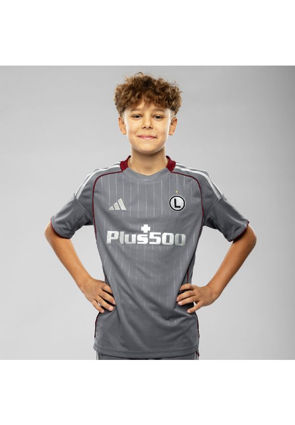 Adidas - Koszulka dziecięca Legia Warszawa Trzeci Komplet na sezon 2025/26. Materiał: tkanina. Wzór: paski. Sport: piłka nożna