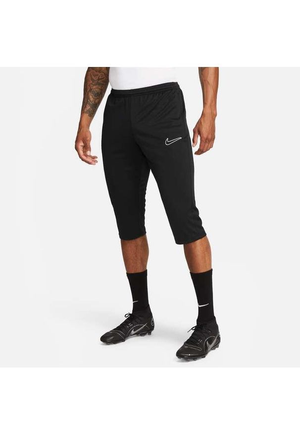 Spodnie treningowe męskie Nike Drifit Academy. Kolor: czarny. Materiał: materiał, syntetyk. Długość: krótkie. Sport: piłka nożna
