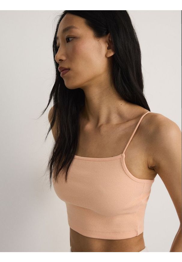 Reserved - Crop top - jasnopomarańczowy. Kolor: pomarańczowy. Materiał: prążkowany, bawełna, dzianina. Długość: krótkie