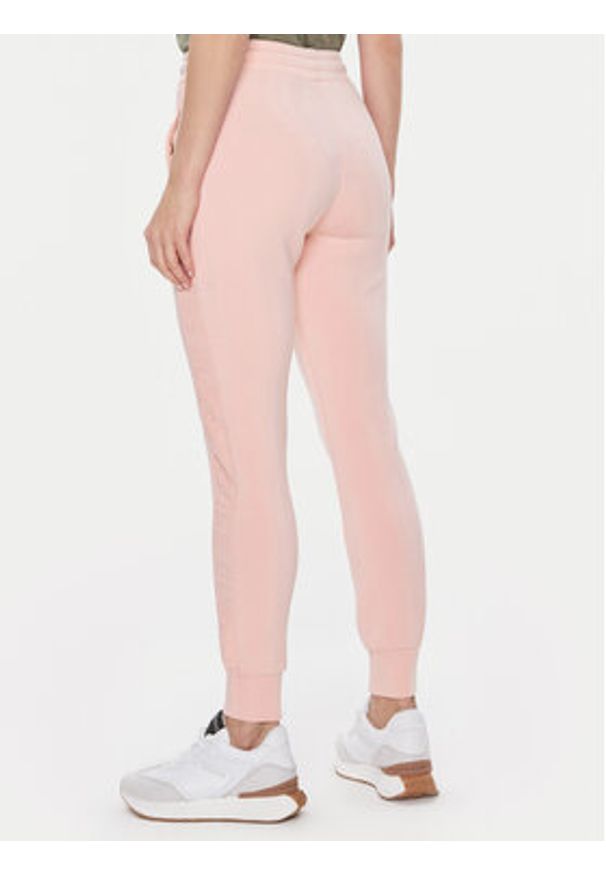 Guess Spodnie dresowe V2YB18 K7UW2 Różowy Regular Fit. Kolor: różowy. Materiał: wiskoza