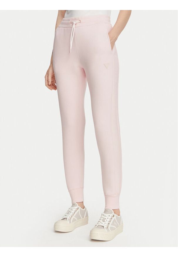 Guess Spodnie dresowe V2YB18 K7UW2 Różowy jasny Regular Fit. Kolor: różowy. Materiał: wiskoza