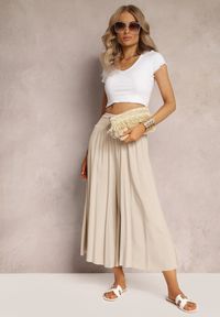 Renee - Jasnobeżowe Szerokie Spodnie High Waist o Długości 7/8 Rathi. Stan: podwyższony. Kolor: beżowy. Materiał: wiskoza, tkanina