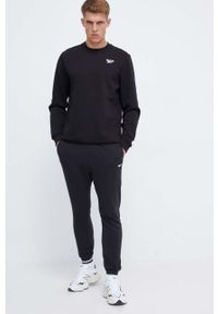 Reebok spodnie męskie kolor czarny gładkie. Kolor: czarny. Materiał: włókno, dzianina, materiał. Wzór: gładki #4