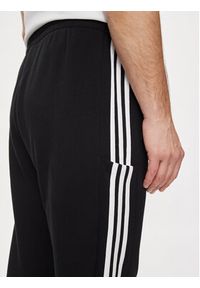 Adidas - adidas Spodnie dresowe Essentials French Terry Tapered Cuff 3-Stripes Joggers HA4337 Czarny Regular Fit. Kolor: czarny. Materiał: bawełna #6