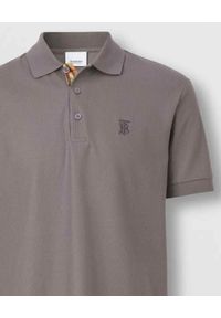 Burberry - BURBERRY - Szara koszulka polo z monogramem. Typ kołnierza: polo. Kolor: szary. Materiał: bawełna. Wzór: haft. Styl: klasyczny