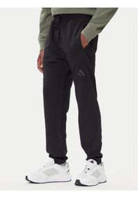 Adidas - adidas Spodnie dresowe ALL SZN Fleece IX1246 Czarny Tapered Leg. Kolor: czarny. Materiał: bawełna