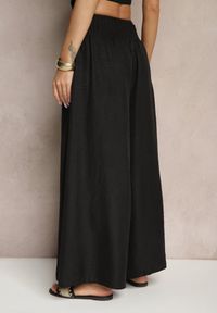 Renee - Czarne Szerokie Spodnie High Waist z Szeroką Gumą w Pasie Korissele. Okazja: na co dzień. Stan: podwyższony. Kolor: czarny. Materiał: guma. Wzór: aplikacja. Styl: elegancki, casual