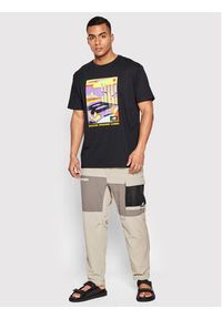 New Balance Spodnie materiałowe MP21502 Beżowy Relaxed Fit. Kolor: beżowy. Materiał: materiał, syntetyk