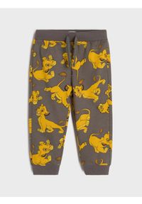 Sinsay - Spodnie dresowe The Lion King - szary. Kolor: szary. Materiał: dresówka