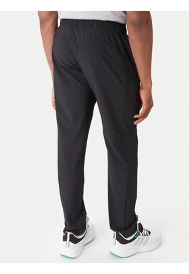 Adidas - adidas Spodnie dresowe Training Essentials Holiday JM5441 Czarny Regular Fit. Kolor: czarny. Materiał: syntetyk