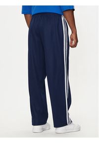 Adidas - adidas Spodnie dresowe adicolor Firebird IZ2466 Granatowy Baggy Fit. Kolor: niebieski. Materiał: bawełna, syntetyk #3