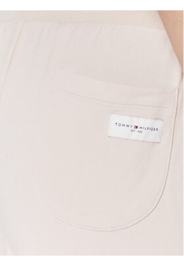 TOMMY HILFIGER - Tommy Hilfiger Spodnie dresowe UW0UW04771 Beżowy Relaxed Fit. Kolor: beżowy. Materiał: dresówka
