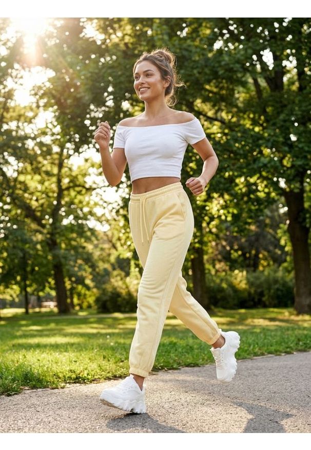 Sinsay - Spodnie jogger z dzianiny terry - żółty. Kolor: żółty. Materiał: dzianina