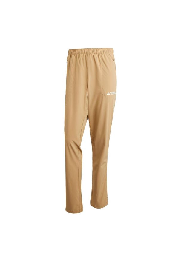 Adidas - Spodnie Multi Essentials Stretch. Kolor: brązowy. Materiał: materiał. Sezon: lato. Sport: turystyka piesza