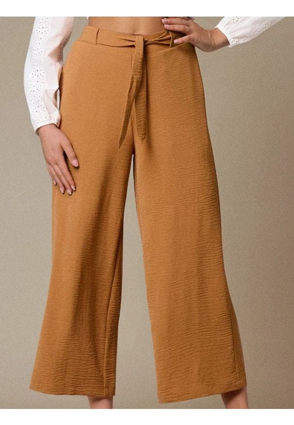 Sinsay - Spodnie wide leg z wiązaniem - żółty. Kolor: żółty