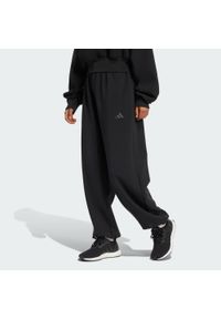 Adidas - Spodnie ALL SZN Soft Lux Loose. Kolor: czarny