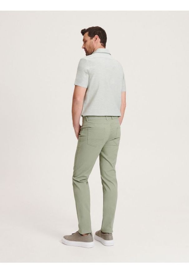 Reserved - Bawełniane spodnie slim fit - jasnoturkusowy. Kolor: turkusowy. Materiał: bawełna