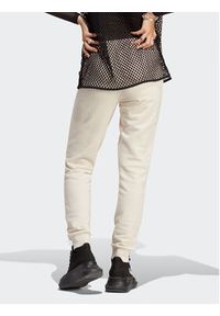 Adidas - adidas Spodnie dresowe adicolor Essentials IA6477 Beżowy Slim Fit. Kolor: beżowy. Materiał: bawełna #6