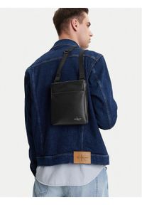 Calvin Klein Jeans Saszetka Mono Logo Flat Pack 18 LV04G3107G Czarny. Kolor: czarny. Materiał: skóra #1