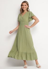 Born2be - Zielona Wiskozowa Kopertowa Sukienka o Rozkloszowanym Kroju Nellrive. Okazja: na co dzień. Typ kołnierza: dekolt w serek. Kolor: zielony. Materiał: wiskoza. Długość rękawa: krótki rękaw. Typ sukienki: kopertowe. Styl: elegancki, casual #1