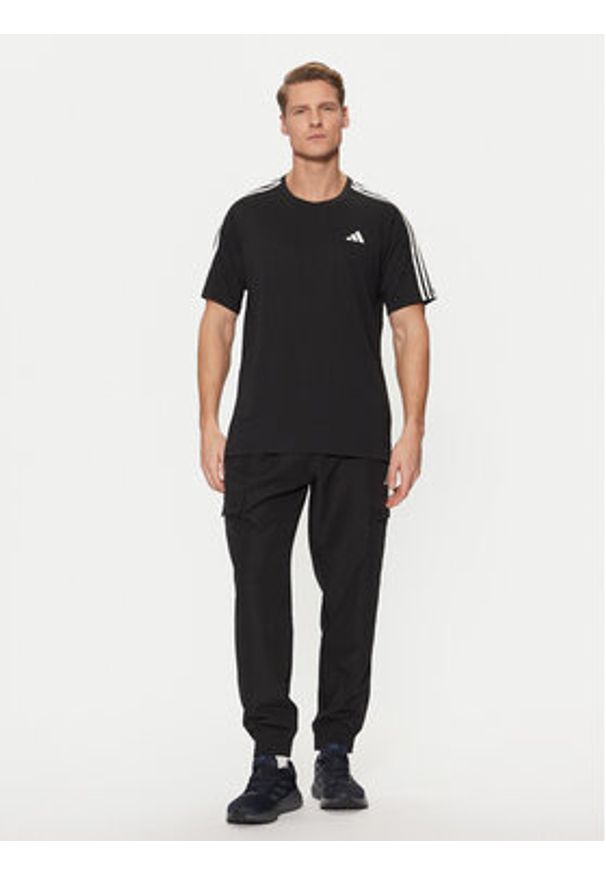 Adidas - adidas Koszulka techniczna Own the Run 3-Stripes IQ3834 Czarny Regular Fit. Kolor: czarny. Materiał: syntetyk. Sport: bieganie