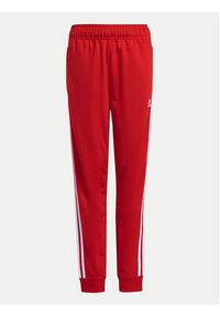Adidas - adidas Spodnie dresowe adicolor SST IX7631 Czerwony Regular Fit. Kolor: czerwony. Materiał: syntetyk #5