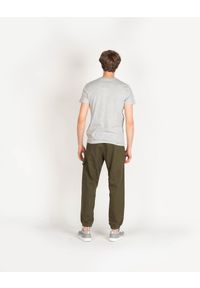 Pepe Jeans Spodnie "Landan" | PM211430 | Landan | Mężczyzna | Khaki. Okazja: na co dzień. Kolor: brązowy. Materiał: poliester, elastan, bawełna. Wzór: nadruk. Styl: casual