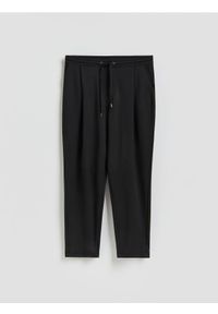 Reserved - Spodnie comfort fit - czarny. Kolor: czarny. Materiał: dzianina #1