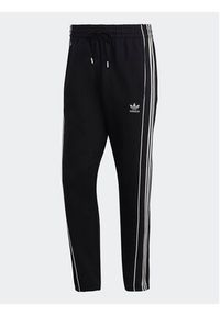Adidas - adidas Spodnie dresowe Rekive HK7319 Czarny Regular Fit. Kolor: czarny. Materiał: bawełna, dresówka #5
