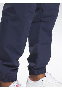 Reebok Spodnie dresowe Classics Vector IA2511 Niebieski Regular Fit. Kolor: niebieski. Materiał: syntetyk, dresówka #6