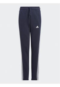Adidas - adidas Spodnie dresowe Essentials 3-Stripes IC6128 Granatowy Slim Fit. Kolor: niebieski. Materiał: bawełna #1