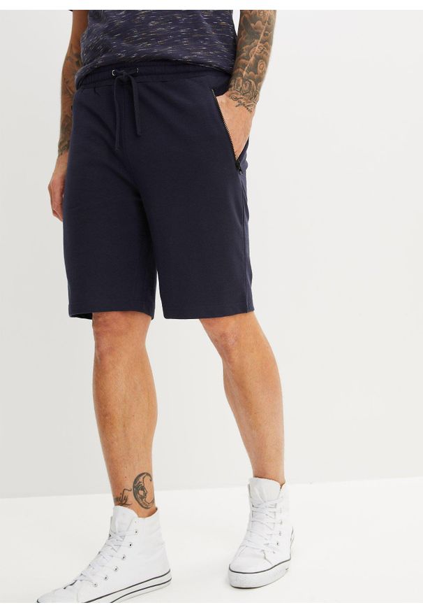 bonprix - Bermudy dresowe z praktycznymi kieszeniami na zamek. Kolor: niebieski. Materiał: dresówka