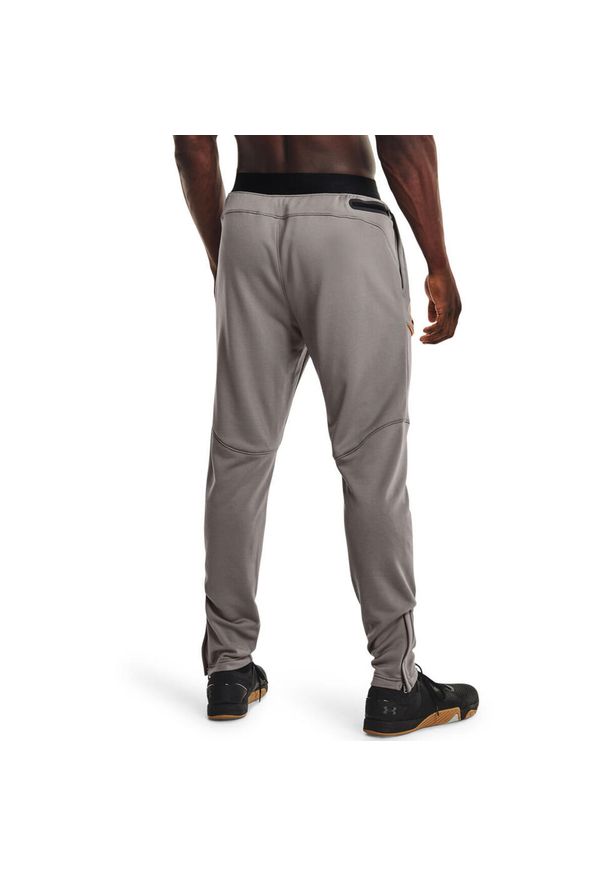 Spodnie Under Armour Terry Evolution, Mężczyźni. Kolor: szary, pomarańczowy, wielokolorowy. Materiał: poliester, materiał. Sport: taniec, joga i pilates