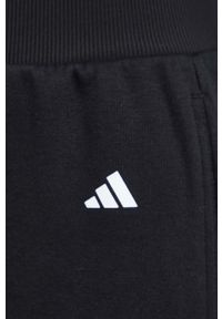 adidas Performance spodnie do jogi Studio kolor czarny gładkie. Kolor: czarny. Materiał: skóra, materiał. Wzór: gładki. Sport: joga i pilates #4