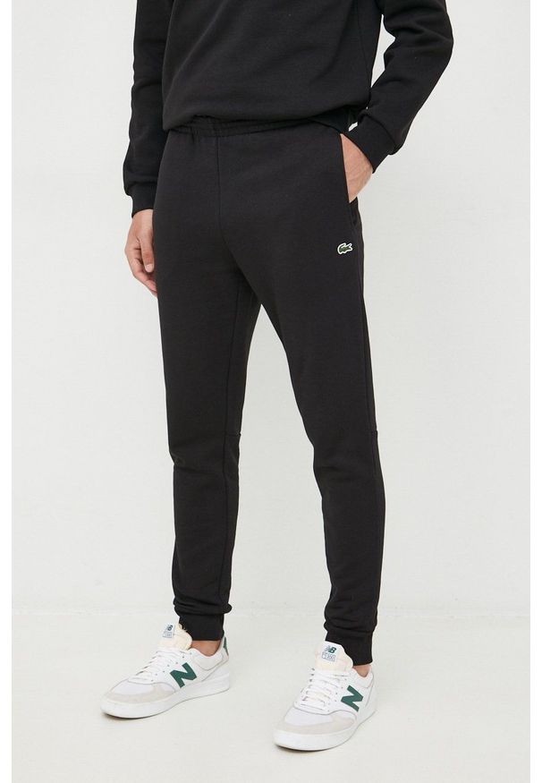 Lacoste spodnie dresowe męskie kolor czarny gładkie XH9624-132. Kolor: czarny. Materiał: dresówka. Wzór: gładki