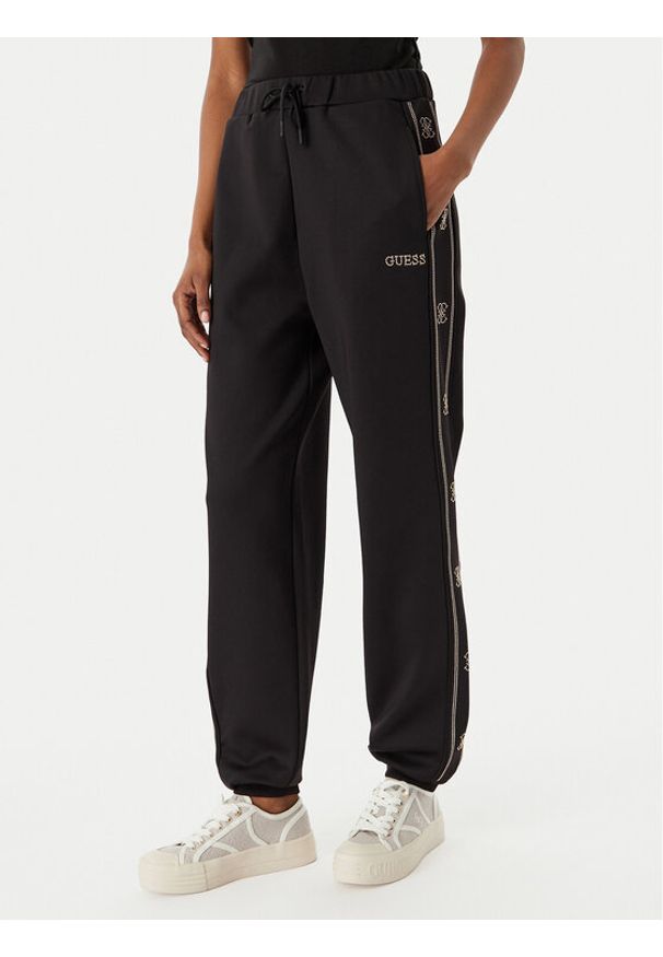 Guess Spodnie dresowe V5BB23 KCX22 Czarny Wide Leg. Kolor: czarny. Materiał: syntetyk