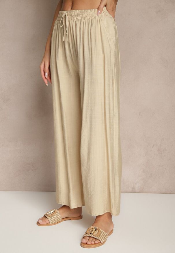 Renee - Beżowe Spodnie z Wiskozy High Waist o Szerokim Kroju Divlise. Okazja: na co dzień. Stan: podwyższony. Kolor: beżowy. Materiał: wiskoza. Styl: casual, elegancki