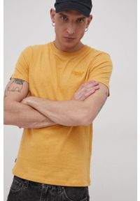 Superdry T-shirt bawełniany kolor żółty gładki. Okazja: na co dzień. Kolor: żółty. Materiał: bawełna. Wzór: gładki. Styl: casual #1