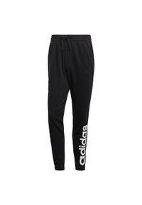 Adidas - Spodnie adidas Essentials Tapered Elastic Cuff Linear. Kolor: czarny. Materiał: bawełna. Sport: fitness